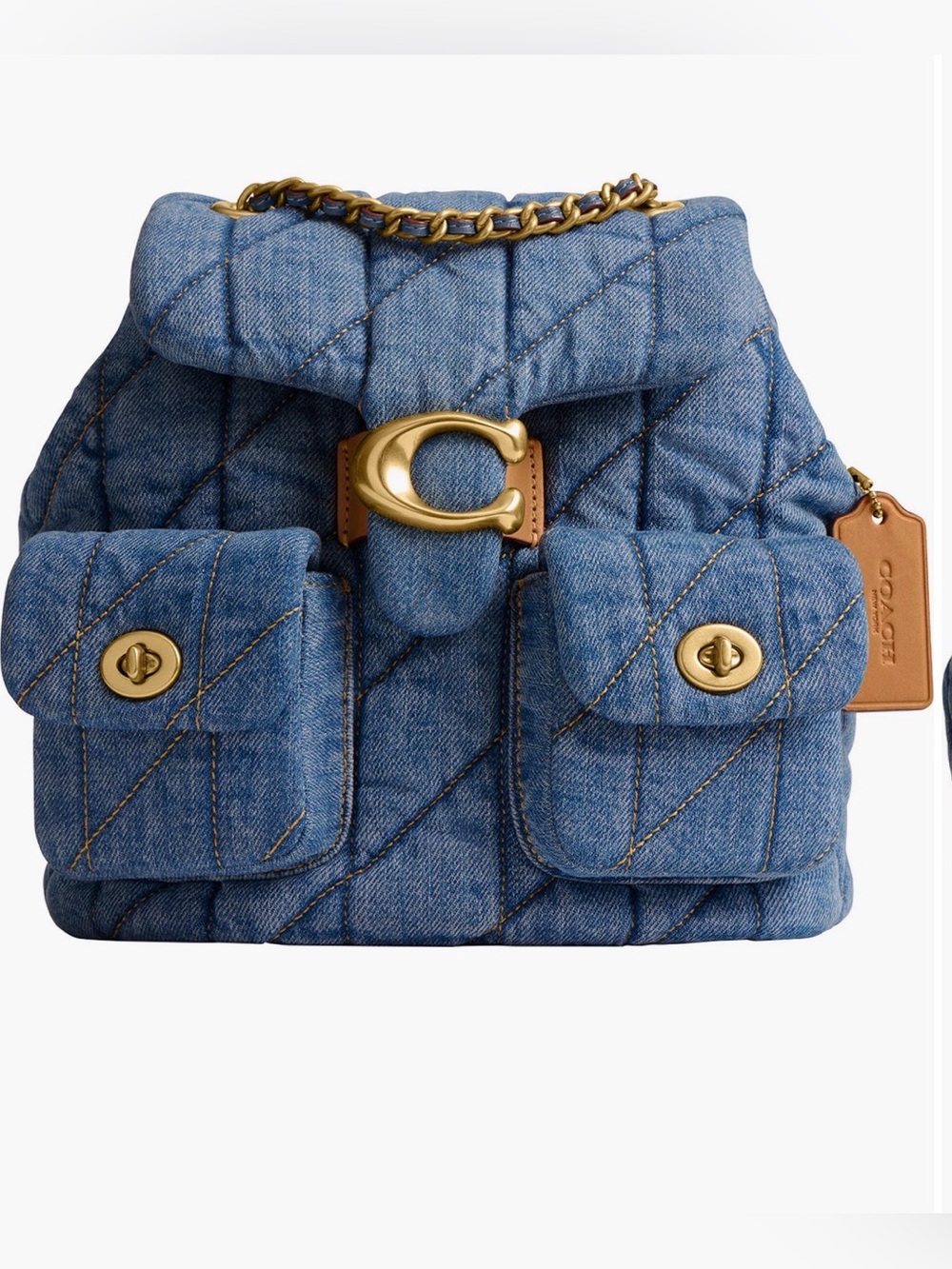 COACH
Tabby Quilted
Denim Backpack. New no tag